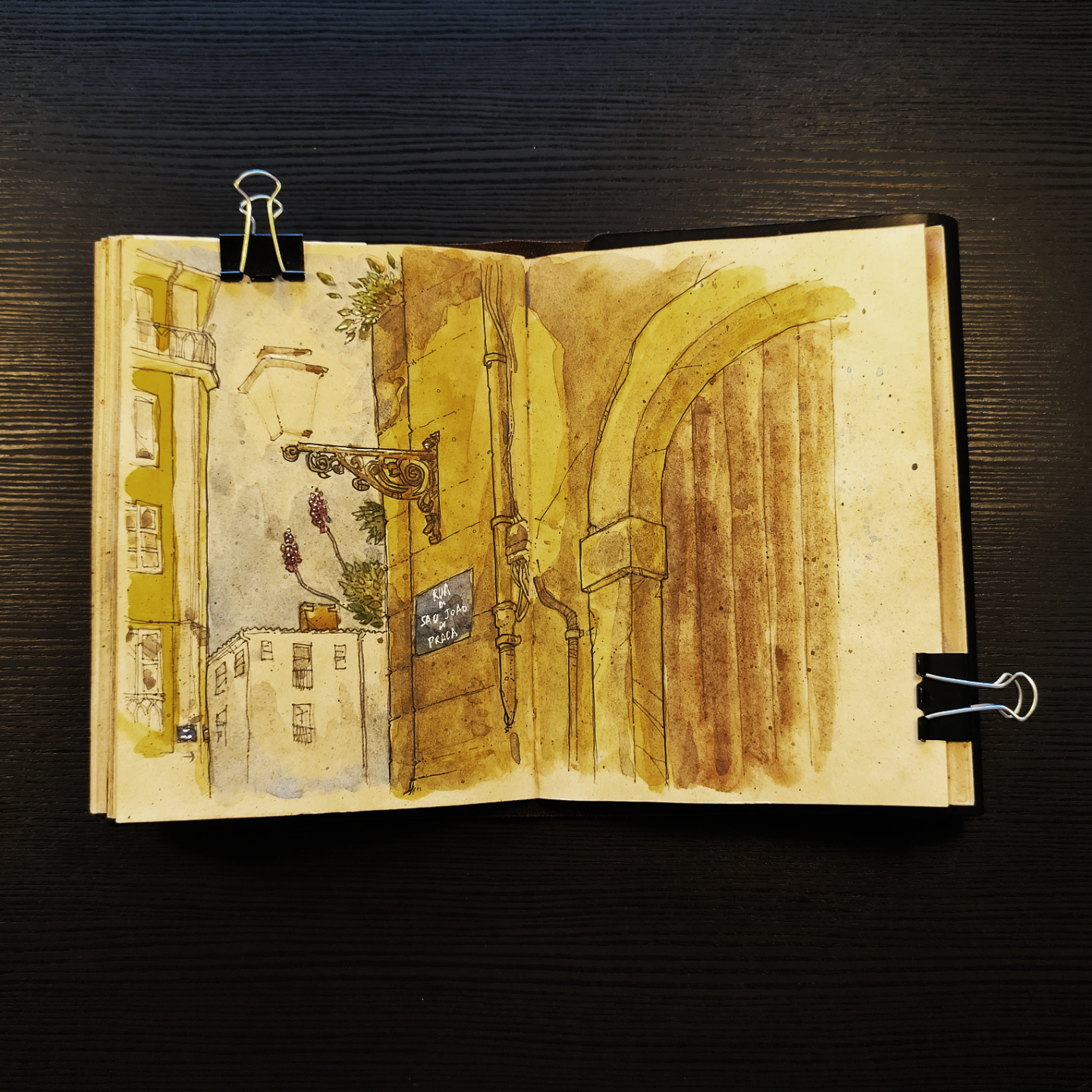 A watercolor of a narrow street in Alfama, Lisbon, and a reunion with an old friend at a local tasca.