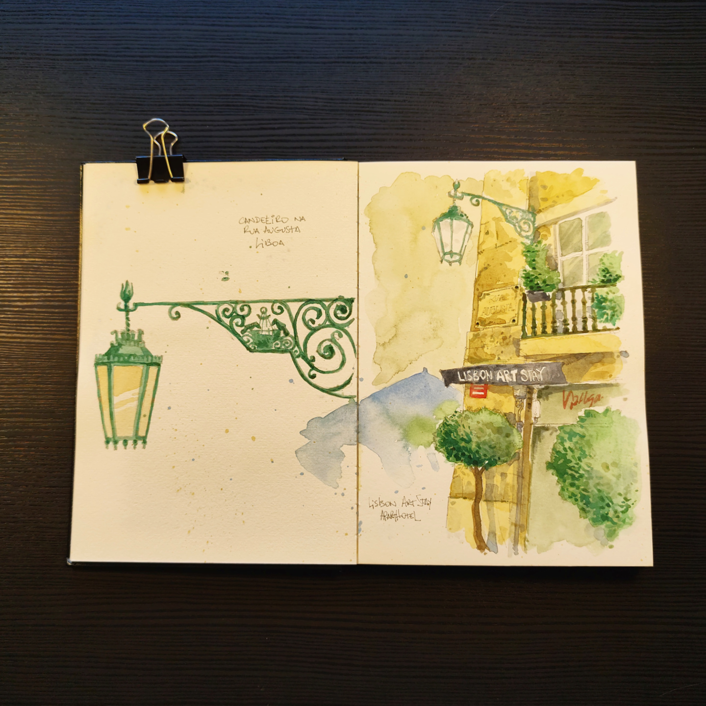 watercolor of an iron streetlamp and a hotel on Rua Augusta, Lisbon